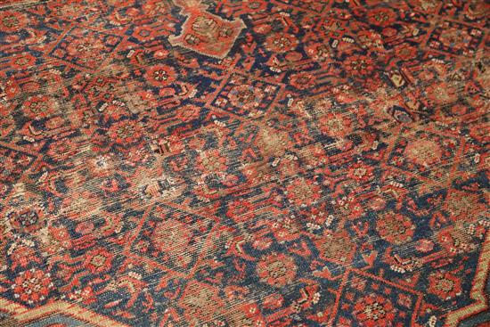 An antique Malayer carpet, dated 1905, 14ft 3in by 10ft 4in.